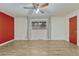 Large bedroom with ceiling fan, light wood flooring, and a large window at 544 S Xenon Ct, Lakewood, CO 80228