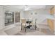 Cozy dining area with sliding glass door, neutral paint, and carpet at 544 S Xenon Ct, Lakewood, CO 80228
