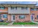 Charming brick townhouse featuring a well-manicured front yard and inviting entrance at 544 S Xenon Ct, Lakewood, CO 80228