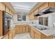 Well-lit kitchen featuring updated appliances and light wood cabinetry at 544 S Xenon Ct, Lakewood, CO 80228