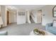 Spacious open-plan living area featuring plush carpeting and ample natural light at 544 S Xenon Ct, Lakewood, CO 80228