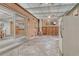 Enclosed brick and concrete patio, featuring ceiling fans, a fridge, and plenty of room for relaxing or entertaining at 544 S Xenon Ct, Lakewood, CO 80228