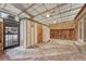 Enclosed brick and concrete patio with fridge, lighting, and access to backyard area at 544 S Xenon Ct, Lakewood, CO 80228