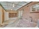 Covered brick and concrete patio with ceiling fans, refrigerator, and access to home at 544 S Xenon Ct, Lakewood, CO 80228