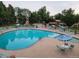 Inviting community pool featuring lounge chairs and umbrellas for relaxation and enjoyment at 544 S Xenon Ct, Lakewood, CO 80228