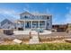 Expansive backyard with patio, hot tub, stone firepit, and scenic stream, ideal for entertaining at 3434 Antelope Ridge Trl, Parker, CO 80138