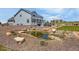 Spacious backyard featuring a scenic pond, stone accents, and lush landscaping, perfect for outdoor enjoyment at 3434 Antelope Ridge Trl, Parker, CO 80138