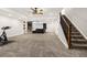 Spacious finished basement with workout area, custom shelving and wall-mounted fireplace feature at 3434 Antelope Ridge Trl, Parker, CO 80138