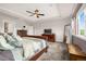 Spacious bedroom with a large window offering great views, trey ceiling, nice furniture, and neutral carpeting at 3434 Antelope Ridge Trl, Parker, CO 80138