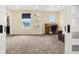 Bonus room features an office nook with built-in shelves, an oval window, and sliding closet door at 3434 Antelope Ridge Trl, Parker, CO 80138