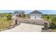 Charming two-story home featuring a welcoming front porch, three-car garage, and beautifully landscaped front yard at 3434 Antelope Ridge Trl, Parker, CO 80138