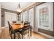 Dining room featuring hardwood floors, ample windows, designer lighting, and neutral wall color at 11781 Bradburn Blvd, Westminster, CO 80031