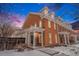 Charming two-story brick townhouse with dormers and a welcoming front porch at 11781 Bradburn Blvd, Westminster, CO 80031