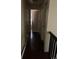 View of hallway with dark wood floors and white doors and trim at 4320 Nepal St, Denver, CO 80249