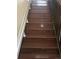 Elegant staircase with modern wood-style floors at 4320 Nepal St, Denver, CO 80249