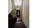 Stairwell featuring wood stairs and a stair lift that leads to a front door at 4320 Nepal St, Denver, CO 80249