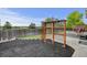 Spacious backyard featuring decorative pergola, lush greenery, wood fence, and mulch for a serene outdoor retreat at 2588 E 116Th Ave, Thornton, CO 80233