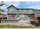 Two story home with back deck, trellis and a well manicured lawn at 2588 E 116Th Ave, Thornton, CO 80233