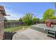 Well-manicured backyard with a wooden deck, decorative pergola, grassy area, and sturdy wooden fence at 2588 E 116Th Ave, Thornton, CO 80233