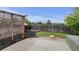 Landscaped backyard with a stylish pergola, mulch ground covering, and a well-kept lawn surrounded by a wooden fence at 2588 E 116Th Ave, Thornton, CO 80233