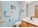 Charming powder room featuring a sink, toilet, and delightful 