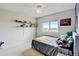 Cozy bedroom featuring a comfortable bed, natural light, and playful decor at 2588 E 116Th Ave, Thornton, CO 80233