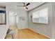 Open dining area features bright light and hardwood floors next to an updated kitchen at 2588 E 116Th Ave, Thornton, CO 80233