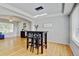 Dining area adjacent to the living room with modern light fixture at 2588 E 116Th Ave, Thornton, CO 80233