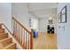 Inviting entryway with hardwood floors and staircase leading to the upper level at 2588 E 116Th Ave, Thornton, CO 80233