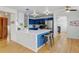 Modern kitchen with stainless appliances, a breakfast bar, and open access to the living spaces at 2588 E 116Th Ave, Thornton, CO 80233