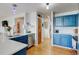 Updated kitchen features stainless steel appliances and bright blue cabinets at 2588 E 116Th Ave, Thornton, CO 80233