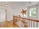 Bright home landing with wooden floors, staircase, and charming overhead fan at 2588 E 116Th Ave, Thornton, CO 80233