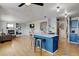 Open living space with hardwood floors, kitchen island, and a fireplace provides plenty of room to live at 2588 E 116Th Ave, Thornton, CO 80233