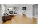 Bright living room features a fireplace, built-in shelving, and hardwood floors at 2588 E 116Th Ave, Thornton, CO 80233