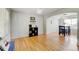 Open-concept living room with hardwood floors and neutral decor at 2588 E 116Th Ave, Thornton, CO 80233