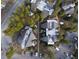 Aerial view of the condo complex showing roofs, walkways, parking, and trees at 1179 Ski Hill Rd # 147, Breckenridge, CO 80424