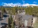 Condo building with balconies, a modern metal roof, and views of the snowy mountains at 1179 Ski Hill Rd # 147, Breckenridge, CO 80424