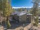 Mountain condo building featuring balconies and scenic views of trees and snow-capped peaks in a natural, serene setting at 1179 Ski Hill Rd # 147, Breckenridge, CO 80424