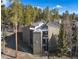 Exterior complex view shows roof lines, balconies and surrounding mature evergreens at 1179 Ski Hill Rd # 147, Breckenridge, CO 80424