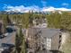 Condo building with balconies, a modern metal roof, and views of the snowy mountains at 1179 Ski Hill Rd # 147, Breckenridge, CO 80424