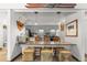 Stylish kitchen showcasing gray cabinets, a unique backsplash, and integrated breakfast bar at 1179 Ski Hill Rd # 147, Breckenridge, CO 80424