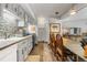 Spacious kitchen with updated appliances, a stylish backsplash, and an adjacent dining area for convenient living at 1179 Ski Hill Rd # 147, Breckenridge, CO 80424