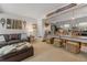 Open-concept living room and kitchen area with comfortable seating, unique decor, and a breakfast bar at 1179 Ski Hill Rd # 147, Breckenridge, CO 80424