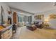 Comfortable living room with wood stove, leather furnishings and natural light streaming through bay window at 1179 Ski Hill Rd # 147, Breckenridge, CO 80424