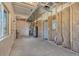 Unfinished basement with exposed insulation and utilities at 241 N Front St # 103, Monument, CO 80132