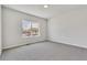 This bedroom is bright with a large window looking out at the neighborhood at 241 N Front St # 103, Monument, CO 80132