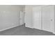 This bedroom features carpet floors and a closet with large sliding doors at 241 N Front St # 103, Monument, CO 80132