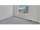 This bedroom is bright with a large window looking out at the neighborhood at 241 N Front St # 103, Monument, CO 80132