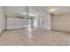 View of a clean and unfinished two car garage with concrete floor at 241 N Front St # 103, Monument, CO 80132