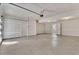 View of a clean and unfinished two car garage with concrete floor at 241 N Front St # 103, Monument, CO 80132